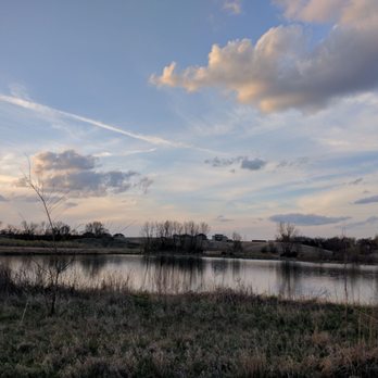 Ada Hayden Heritage Park - The setting sun illuminates the passing of a storm - Parks Near Me - Ames, Iowa