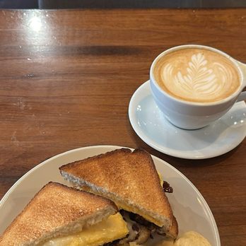 La Reunion - B.E.C sandwich and vanilla latte. - Bars Near Me - Dallas, Texas