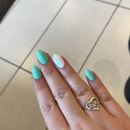 Green nails with a white accent nail Green nails with a white accent nail