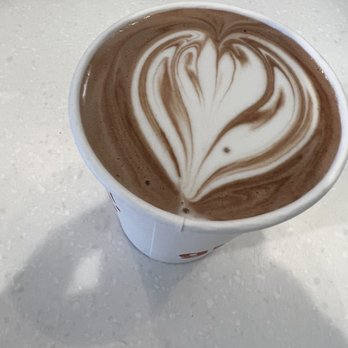 Gimme! Coffee - a cup of coffee on a table - Coffee & Tea Near Me - Ithaca, New York