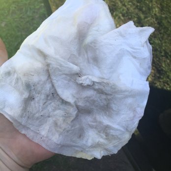 Madadashcar - Dirt on radio and heat control area from a quick wipe down after "complete detail" was finished - Auto Repair Near Me