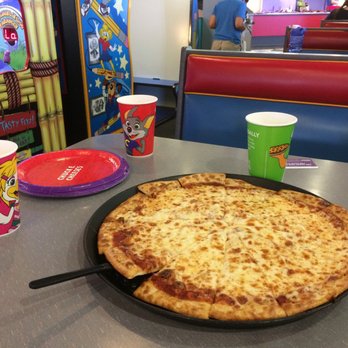 Chuck E. Cheese - a pizza on a table - Pizza Near Me - Spokane, Washington