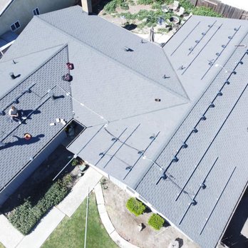 Renewable Solutions - Men up on the roof placing all the micro-inverter things. - Solar Installation Near Me - Sacramento, California Renewable Solutions - Men up on the roof placing all the micro-inverter things. - Solar Installation Near Me - Sacramento, California
