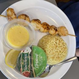 Grilled scallops, seasoned rice and lemon butter Grilled scallops, seasoned rice and lemon butter