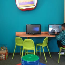 A Smile Pediatric Dentistry - Cartoons playing on the apple tv and two desktops ready with games !