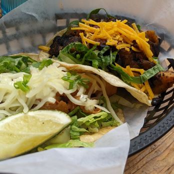 Taco Taco - a basket of food on a table - Mexican Near Me - Toronto, Ontario