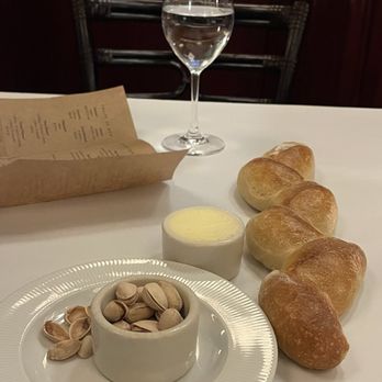Bouchon - Pistachio nuts and freshly made bread laid right on the table. - French Near Me - Las Vegas, Nevada Bouchon - Pistachio nuts and freshly made bread laid right on the table. - French Near Me - Las Vegas, Nevada