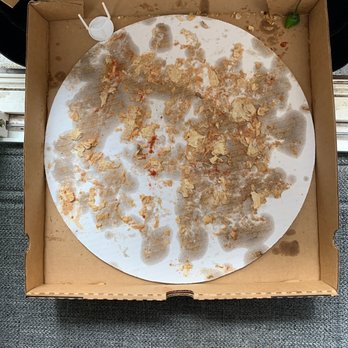 Beggars Pizza - Most of the bread sticks to the cardboard! - Pizza Near Me - Maywood, Illinois