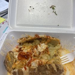 Dos Mundos - My half eaten spud with some added hot sauce.