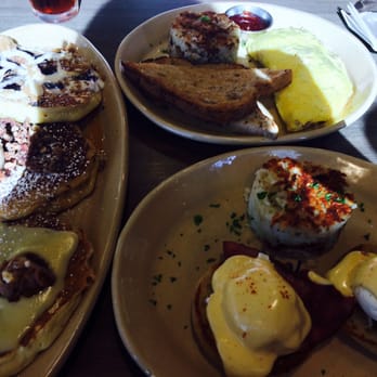 Snooze, an A.M. Eatery - Ham Benedict, omelet, and three pancakes (upside down pineapples, blueberry Danish, and sweet potatoe - Breakfast & Brunch Near Me - Gilbert, Arizona