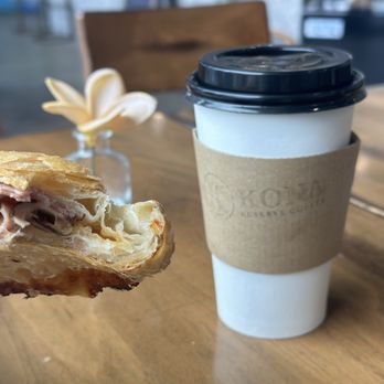 Kona Reserve Coffee - Ham and cheese empanada and vanilla latte with cinnamon - Coffee & Tea Near Me - Houston, Texas Kona Reserve Coffee - Ham and cheese empanada and vanilla latte with cinnamon - Coffee & Tea Near Me - Houston, Texas