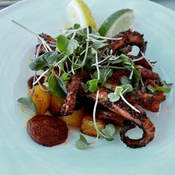 Louie's Backyard - Charred Baby Octopus with Chorizo, Potatoes and Chili Oil - New American Near Me - Key West, Florida