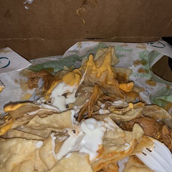 Taco Bell - Nacho box that should have beans and guacamole but it doesn't and was missing two double chalupas from our order. - Fast Food Near Me - Elkins, West Virginia Taco Bell - Nacho box that should have beans and guacamole but it doesn't and was missing two double chalupas from our order. - Fast Food Near Me - Elkins, West Virginia