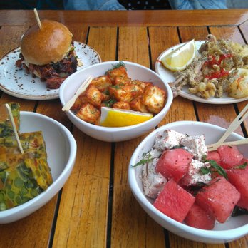 The Cut - Tapas sharing plates: pulled pork burger, calamari, halloumi, sweet potato fritatta, watermelon and feta with mint. - Bars Near Me - London, XGL The Cut - Tapas sharing plates: pulled pork burger, calamari, halloumi, sweet potato fritatta, watermelon and feta with mint. - Bars Near Me - London, XGL