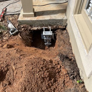Engineered Solutions of Georgia - Photo of pier being installed under front stoop. - Waterproofing Near Me - Smyrna, Georgia Engineered Solutions of Georgia - Photo of pier being installed under front stoop. - Waterproofing Near Me - Smyrna, Georgia