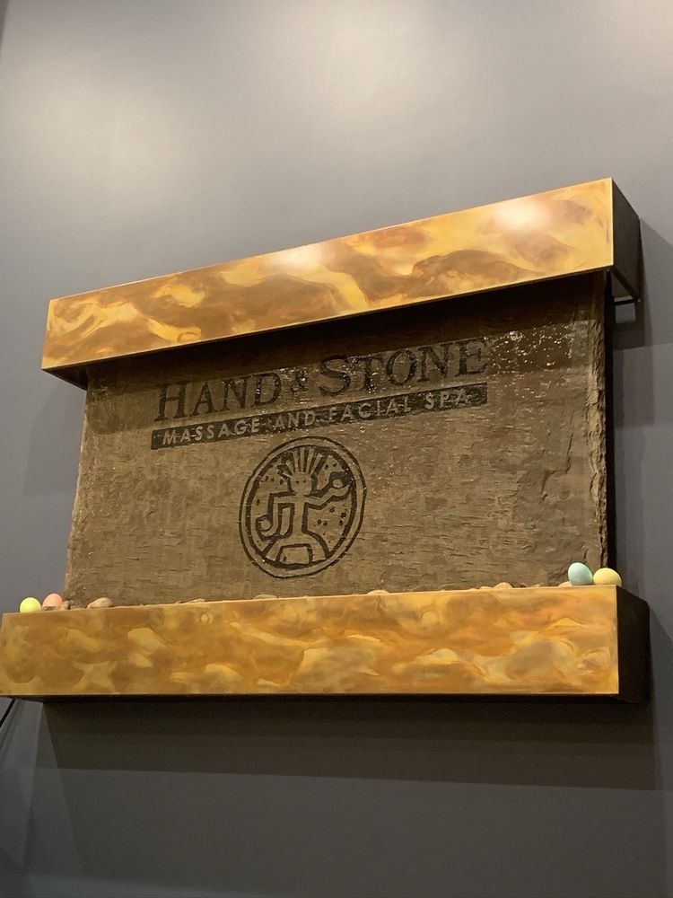 Hand & Stone Massage and Facial Spa Logo