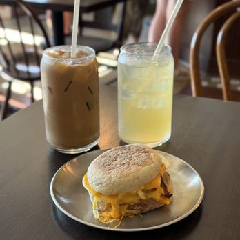Karol Coffee - Garden Latte (Left); Sparkling Blackberry Iced Green tea (Right); Breakfast sandwich (Front) - Coffee Roasteries Near Me - Saint Paul, Minnesota Karol Coffee - Garden Latte (Left); Sparkling Blackberry Iced Green tea (Right); Breakfast sandwich (Front) - Coffee Roasteries Near Me - Saint Paul, Minnesota