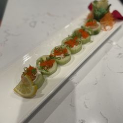 Umami Thai - UMAMI Roll: Salmon, avocado, cream cheese, crabmeat, masago, and scallions wrapped in cucumber; served with ponzu sauce
