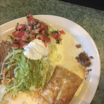 El Palenque - Beef chimichanga after a couple bites. More than half still remains on the plate. Child sized portion compared to most Mexican restaurants. - Mexican Near Me - Noblesville, Indiana El Palenque - Beef chimichanga after a couple bites. More than half still remains on the plate. Child sized portion compared to most Mexican restaurants. - Mexican Near Me - Noblesville, Indiana