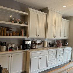 Open shelves, roll out cabinets below drawers, and a hutch on the end.