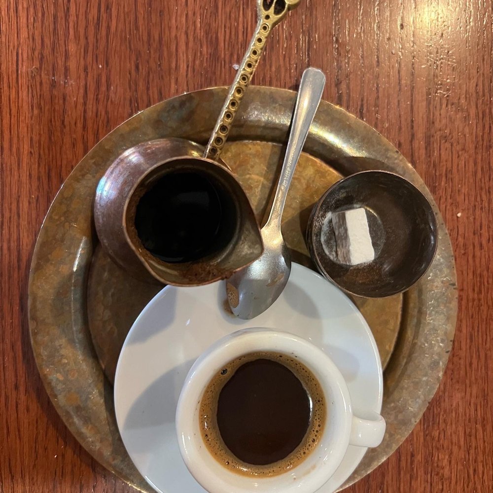 Old Town Sarajevo - a cup of coffee and a spoon - Modern European Near Me - Phoenix, Arizona Old Town Sarajevo - a cup of coffee and a spoon - Modern European Near Me - Phoenix, Arizona