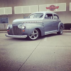 41 Chevy in front of shop