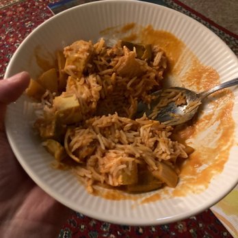 India Cafe - a person holding a bowl of food - Indian Near Me - Ypsilanti, Michigan India Cafe - a person holding a bowl of food - Indian Near Me - Ypsilanti, Michigan
