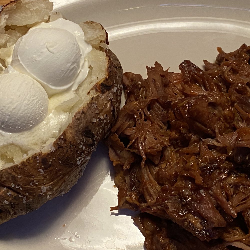 Texas Roadhouse - BBQ Pulled Pork with a Baked Potato, butter and sour cream - Steakhouses Near Me - Grove City, Ohio Texas Roadhouse - BBQ Pulled Pork with a Baked Potato, butter and sour cream - Steakhouses Near Me - Grove City, Ohio