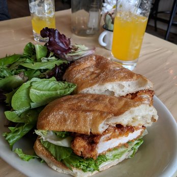 Oddfellows Cafe & Bar - Fried chicken sandwich with house-made pickles and a side salad. - Breakfast & Brunch Near Me - Seattle, Washington