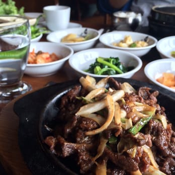Seoul Restaurant - Beef bulgogi with banchan and part of the black pot which contains kimchi jigae. - Chinese Near Me - Istanbul, 34 Seoul Restaurant - Beef bulgogi with banchan and part of the black pot which contains kimchi jigae. - Chinese Near Me - Istanbul, 34