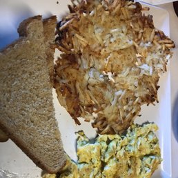 Scrambled eggs with hash browns and toast Scrambled eggs with hash browns and toast
