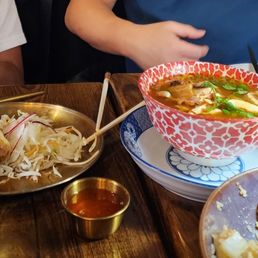 Tom Yum Soup Fried Calamari Veggies Spring Rolls Crispy Pork Belly (spicy) Crabmeat Fried Rice Steamed Jasmine Rice Green Curry