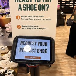 DICK'S Sporting Goods - You scan the shoe you want and they bring it to you! No waiting!