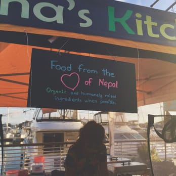 Kancha's Kitchen - a woman standing under a tent - Street Vendors Near Me - Alameda, California