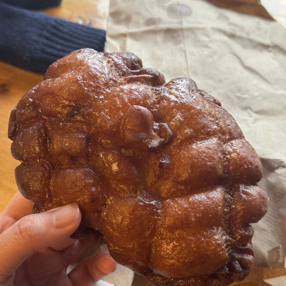 Maverick's Donut Company - a hand holding a donut - Coffee & Tea Near Me - Toronto, Ontario Maverick's Donut Company - a hand holding a donut - Coffee & Tea Near Me - Toronto, Ontario