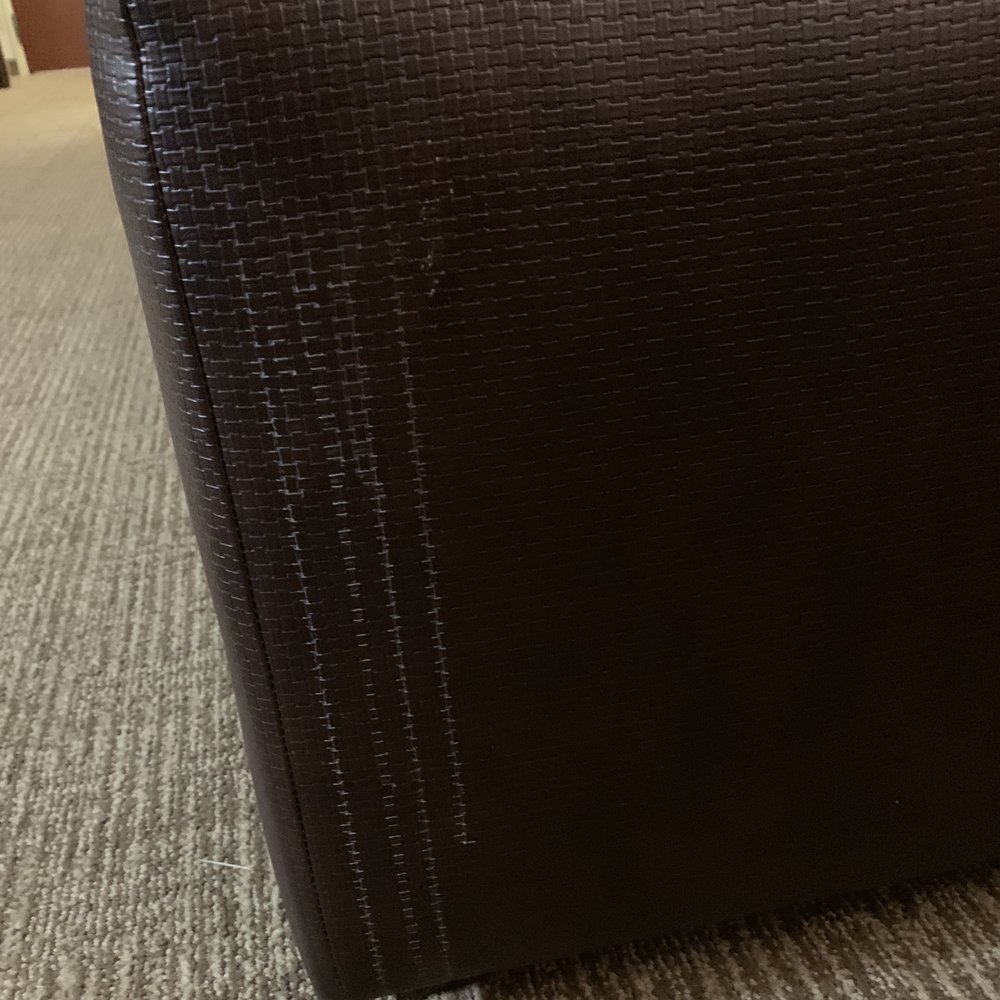 Whitish Body fluid left on ottoman from previous guest