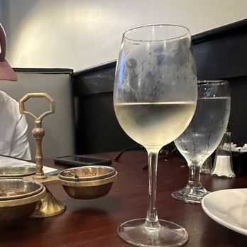 Bombay Curry - Pinot Grigio and complementary sauces in the background - Indian Near Me - Raleigh, North Carolina Bombay Curry - Pinot Grigio and complementary sauces in the background - Indian Near Me - Raleigh, North Carolina