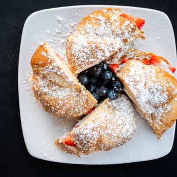 Teaspoon - a plate of pastries with powdered sugar and blueberries - Breakfast & Brunch Near Me - Tucson, Arizona Teaspoon - a plate of pastries with powdered sugar and blueberries - Breakfast & Brunch Near Me - Tucson, Arizona