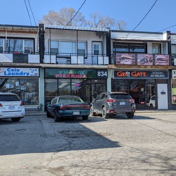 Frank Pizzeria - Looking at the restaurant from the sidewalk by the street on the far side of the strip mall parking lot. April 2022 - Pizza Near Me - Toronto, Ontario Frank Pizzeria - Looking at the restaurant from the sidewalk by the street on the far side of the strip mall parking lot. April 2022 - Pizza Near Me - Toronto, Ontario