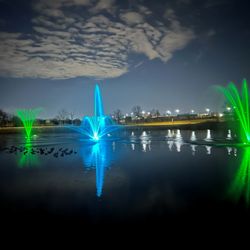 Heartland Park - Fountains at night in Heartland Park Lake