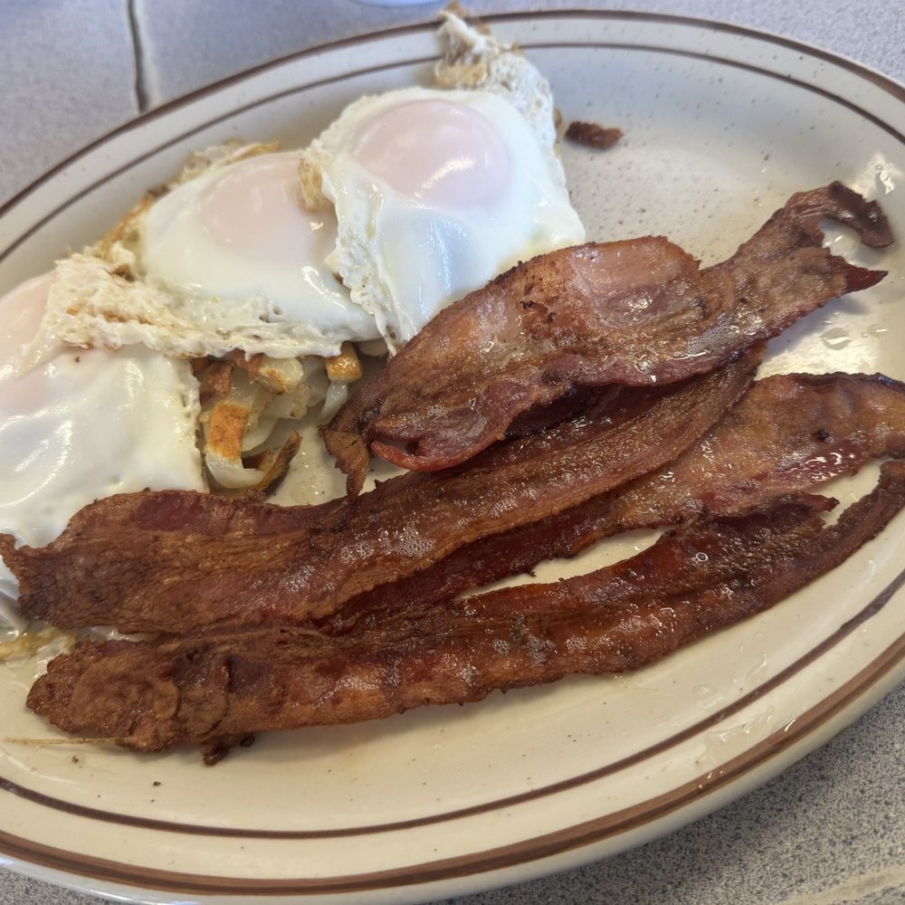 Eggs basted, hash browns and bacon. Eggs basted, hash browns and bacon.
