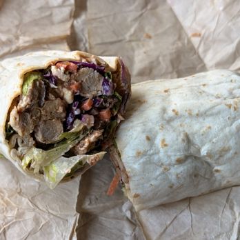 Just Salad - Buffalo Chicken Wrap with romaine, carrots, red cabbage and braised chicken with buffalo ranch. - Salad Near Me - Orlando, Florida Just Salad - Buffalo Chicken Wrap with romaine, carrots, red cabbage and braised chicken with buffalo ranch. - Salad Near Me - Orlando, Florida