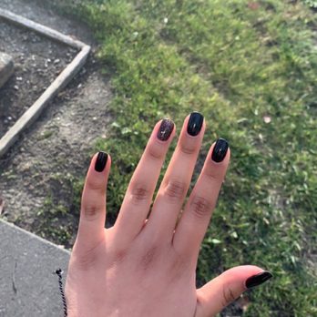 Looking Good Salon & Spas - Basic black gel manicure with a black sparkly nail - Hair Salons Near Me - Davis, California Looking Good Salon & Spas - Basic black gel manicure with a black sparkly nail - Hair Salons Near Me - Davis, California