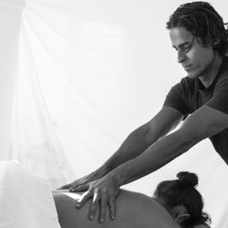 L&G Massage Therapy Center - working on the deep muscles of the back to get rid of knots and improve circulation.