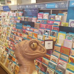 Werner's Hallmark Shop - Bob the Raptor says "If you need greeting card paper these mammals can help."