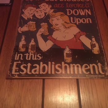 Scotty's - a woman holding a glass of beer - Dive Bars Near Me - Kenosha, Wisconsin