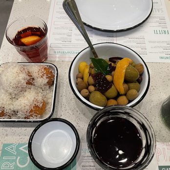 Pizzeria Luca - Arancini app, warm olives, Lambrusco in foreground and a (tiny) Negroni - Italian Near Me - Lancaster, Pennsylvania