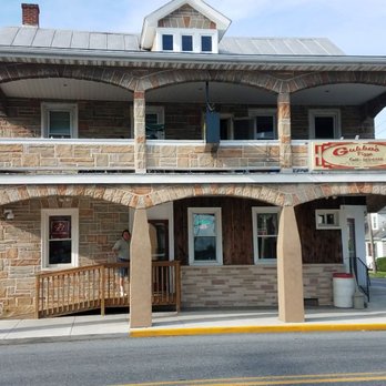 Gubba's - a brick building with a sign on the front of it - Pizza Near Me - Fredericksburg, Pennsylvania