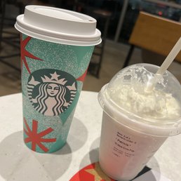 a cup of coffee and a drink on a table a cup of coffee and a drink on a table