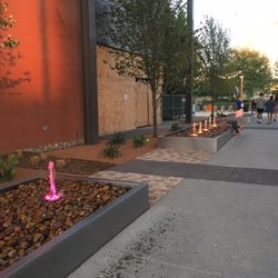 Water fountains in the entrance, kiddos having fun with the coloured lights and water.